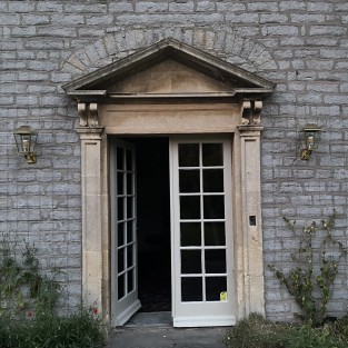 Kemble Wall Lantern in Polished Brass Unlacquered Finish